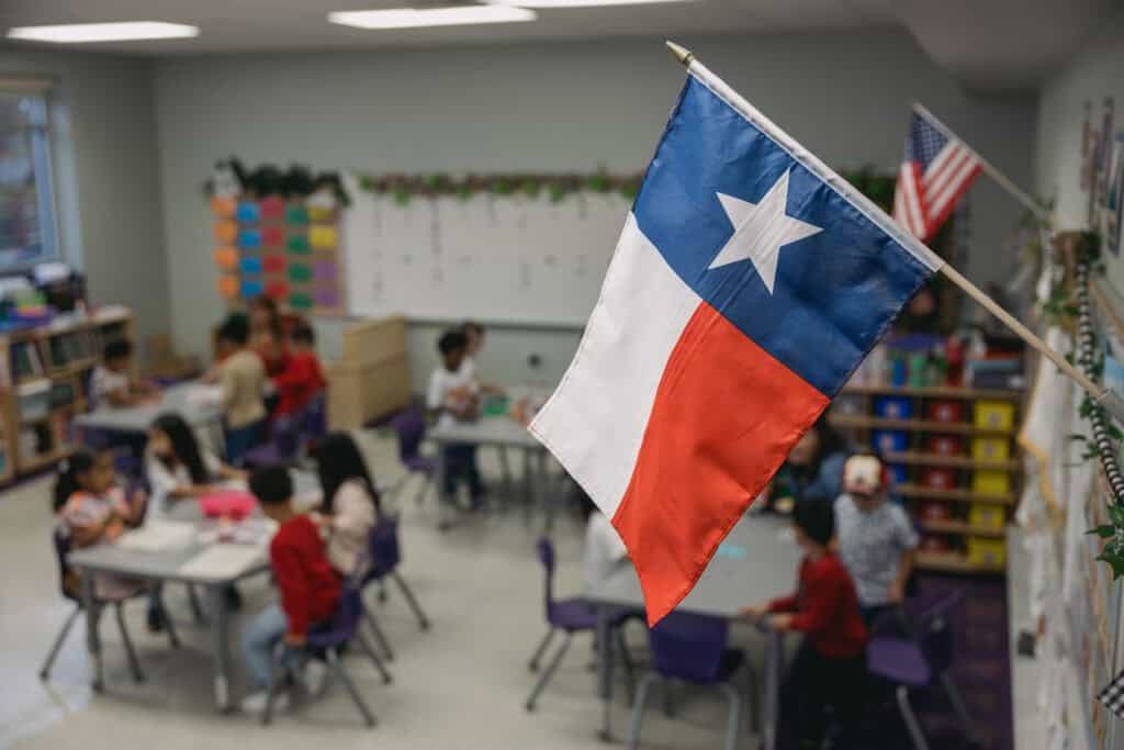 Elementary school classroom with a Texas flag in the foreground